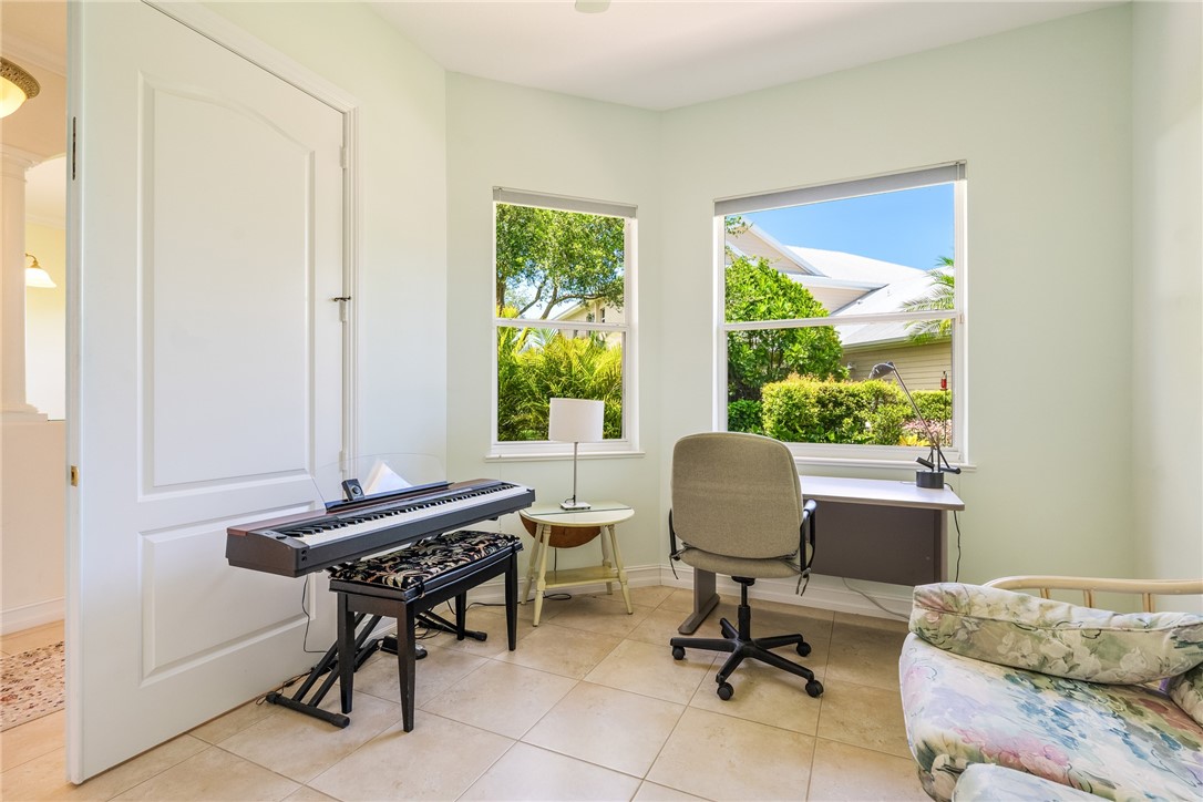 4565 Bridgepointe Way, Unit 142 Vero Beach, FL 32967 - Photo 18 of 36 a view of a workspace with furniture and a window