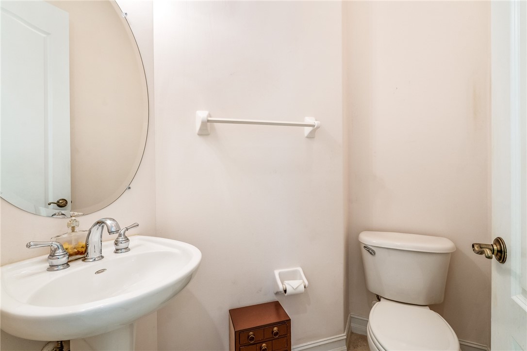4565 Bridgepointe Way, Unit 142 Vero Beach, FL 32967 - Photo 19 of 36 a bathroom with a toilet sink and mirror