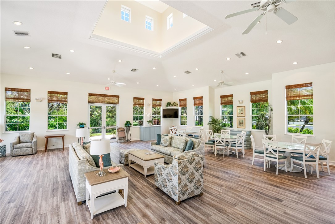 4565 Bridgepointe Way, Unit 142 Vero Beach, FL 32967 - Photo 32 of 36 a living room with furniture and a large window