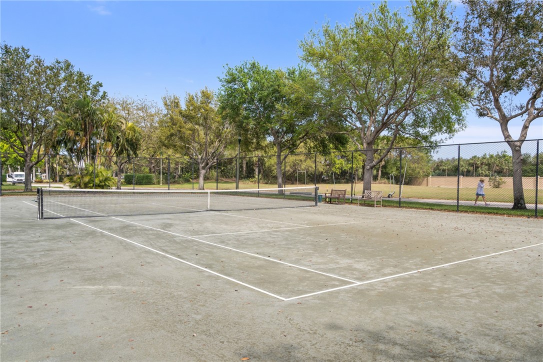 4565 Bridgepointe Way, Unit 142 Vero Beach, FL 32967 - Photo 35 of 36 a view of a tennis court