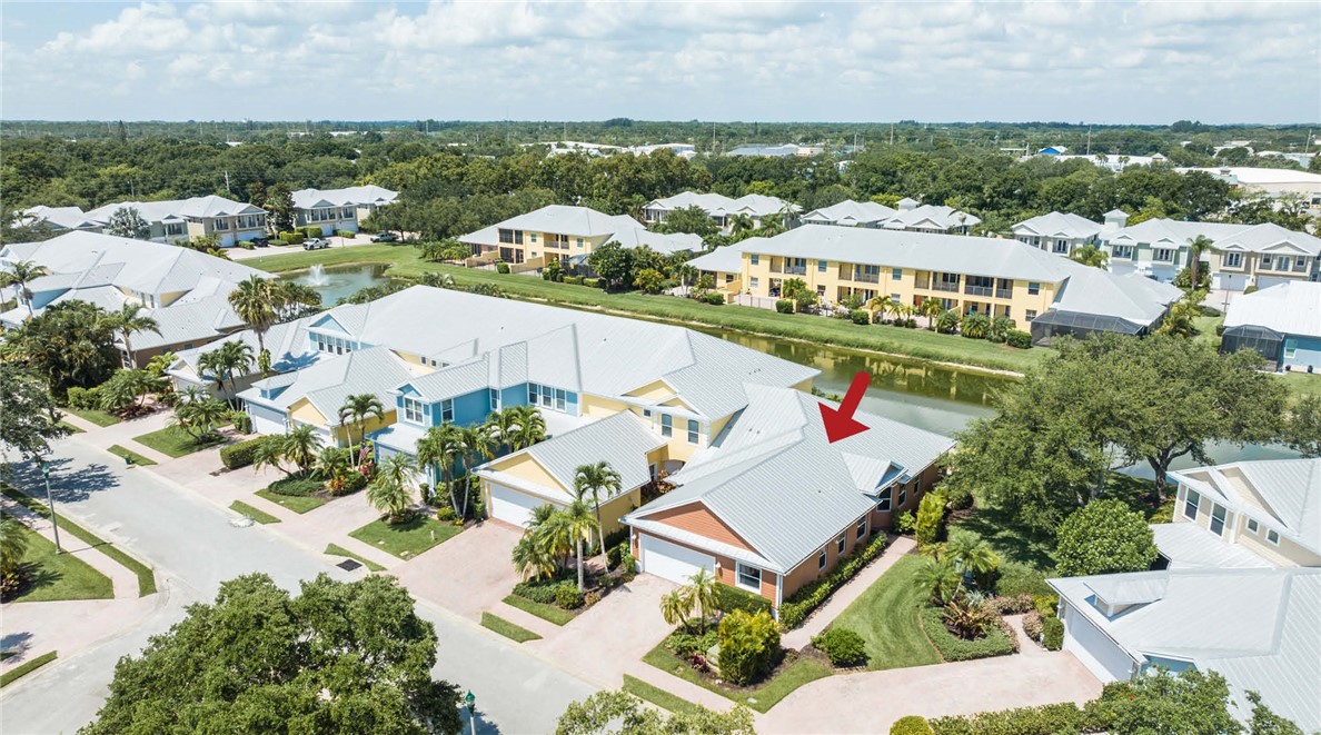 4565 Bridgepointe Way, Unit 142 Vero Beach, FL 32967 - Photo 36 of 36 an aerial view of residential houses with outdoor space and river