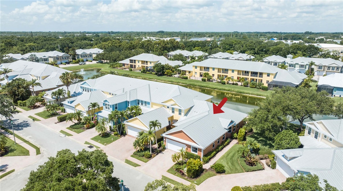 4565 Bridgepointe Way, Unit 142 Vero Beach, FL 32967 - Photo 6 of 36 an aerial view of residential houses with outdoor space and parking