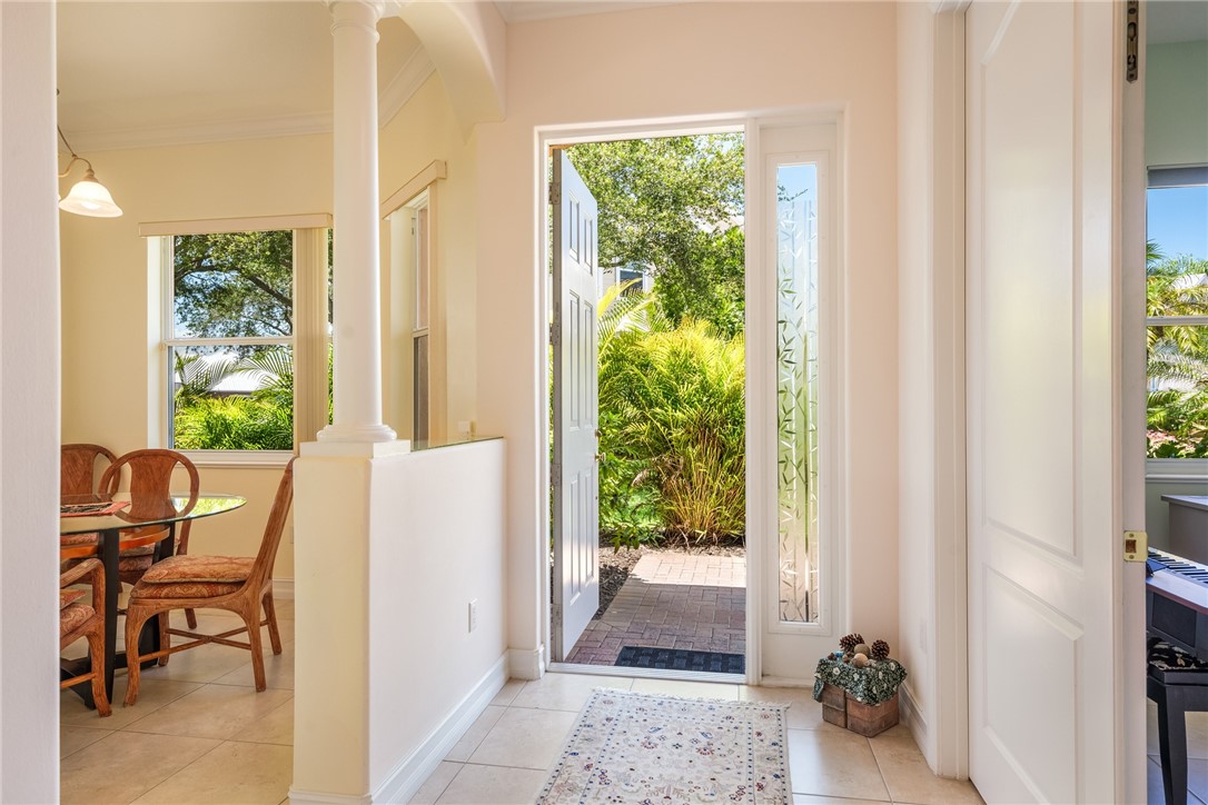 4565 Bridgepointe Way, Unit 142 Vero Beach, FL 32967 - Photo 7 of 36 a view of a door and chair in the balcony