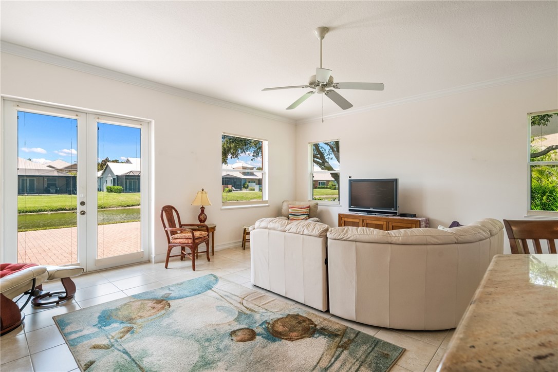 4565 Bridgepointe Way, Unit 142 Vero Beach, FL 32967 - Photo 10 of 36 a living room with furniture and a flat screen tv