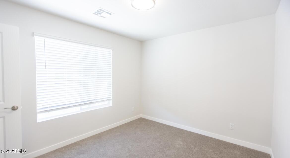 1850 North 51st Street, Unit 5 Phoenix, AZ 85008 - Photo 15 of 23 a view of an empty room with a window