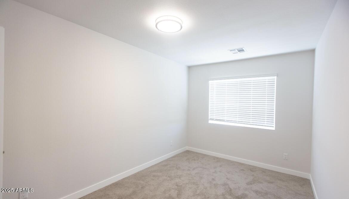 1850 North 51st Street, Unit 5 Phoenix, AZ 85008 - Photo 16 of 23 an empty room with a window