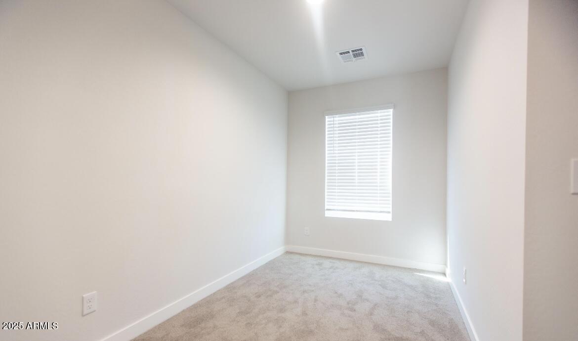 1850 North 51st Street, Unit 5 Phoenix, AZ 85008 - Photo 17 of 23 a view of an empty room with a window