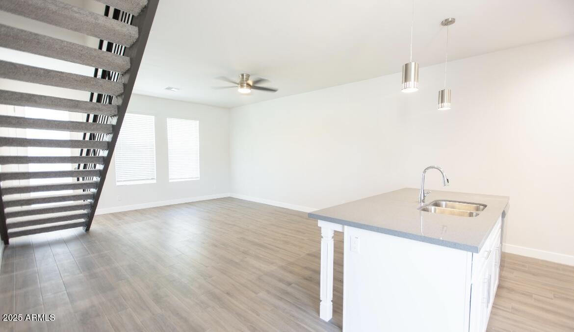 1850 North 51st Street, Unit 5 Phoenix, AZ 85008 - Photo 5 of 23 a bathroom with a sink a mirror and wooden floor
