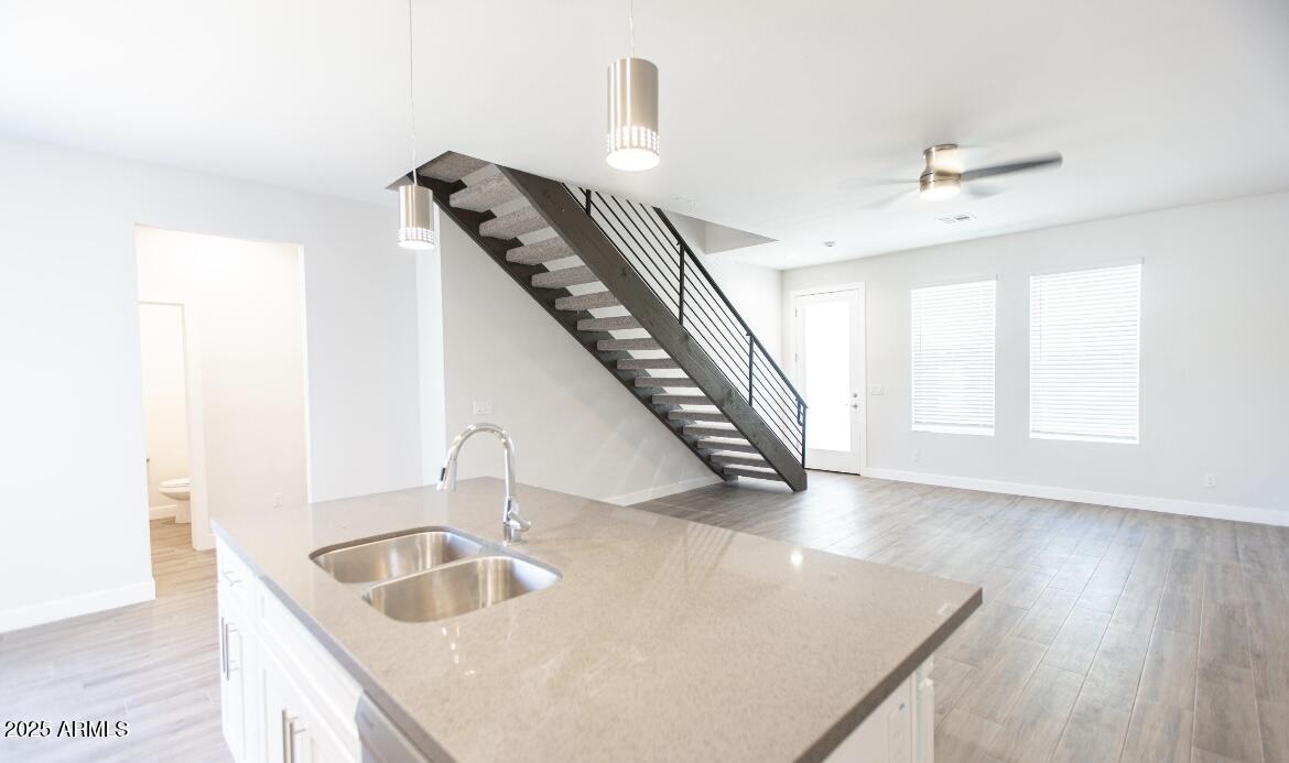 1850 North 51st Street, Unit 5 Phoenix, AZ 85008 - Photo 6 of 23 a kitchen with a sink and a hard wood floor
