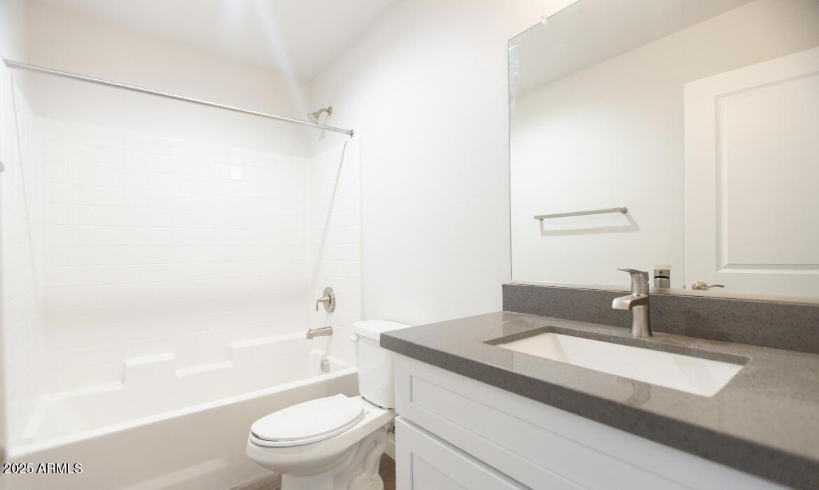 1850 North 51st Street, Unit 5 Phoenix, AZ 85008 - Photo 8 of 23 a bathroom with a granite countertop sink toilet and shower