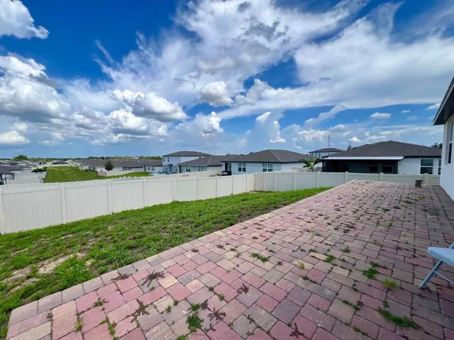 a kitchen that has a stove and a table in it