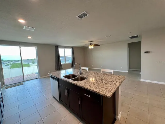a bathroom with a shower and a sink