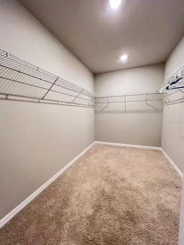 a bathroom with a granite countertop sink toilet mirror and bathtub