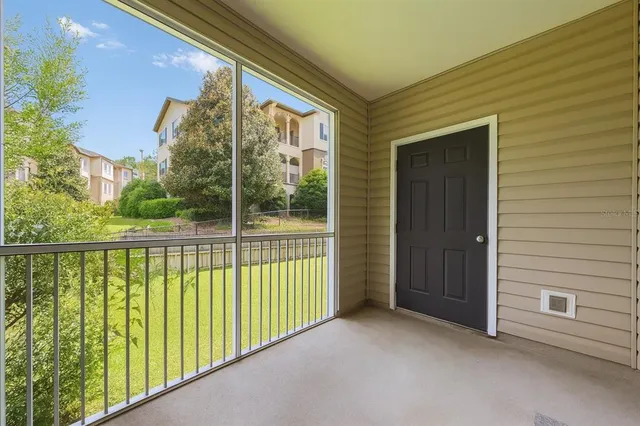 a view of balcony with furniture
