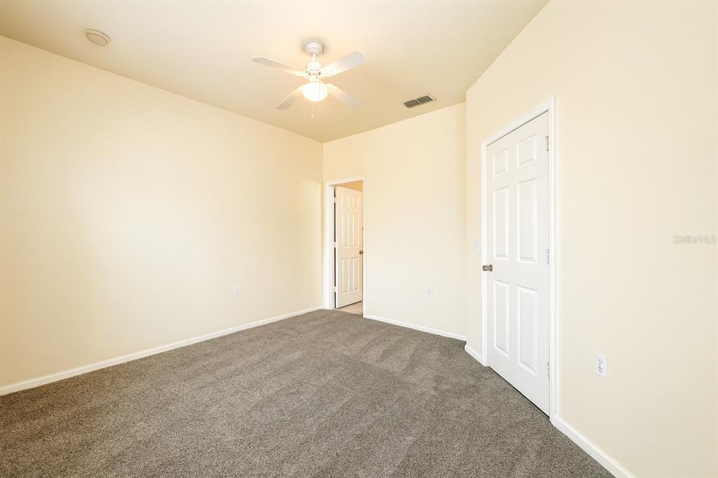 4877 Northwest 42nd Road, Unit 106 Gainesville, FL 32606 - Photo 14 of 27 a view of a room with a ceiling fan