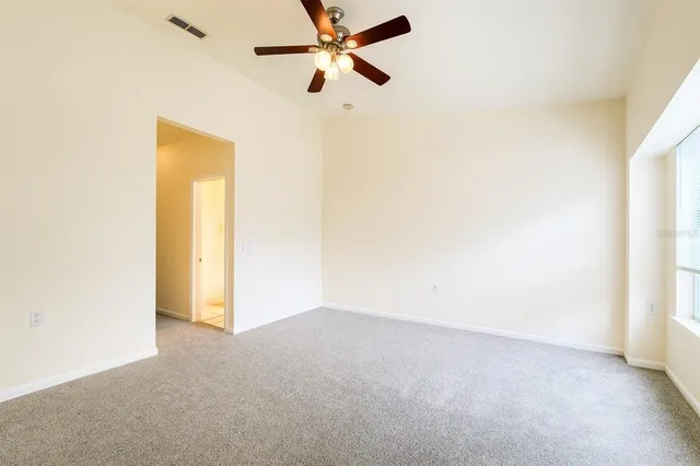 a view of a big room with carpet