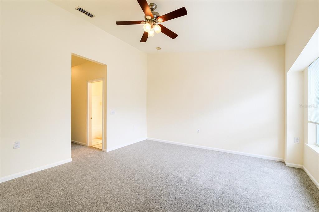 4877 Northwest 42nd Road, Unit 106 Gainesville, FL 32606 - Photo 20 of 27 a view of a big room with carpet