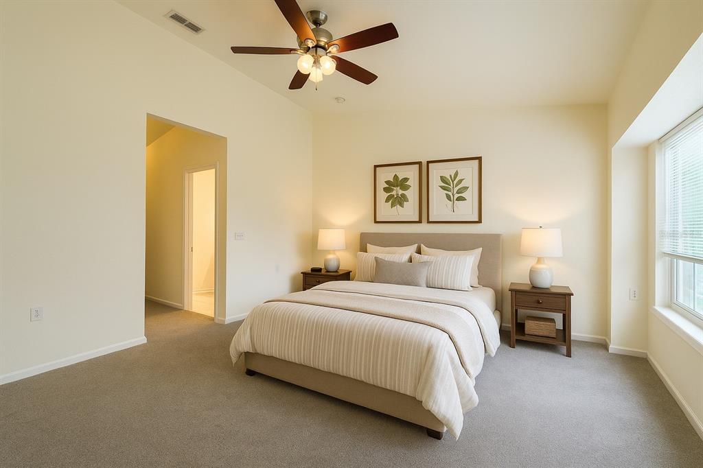 4877 Northwest 42nd Road, Unit 106 Gainesville, FL 32606 - Photo 21 of 27 a bedroom with a bed and a painting on the wall