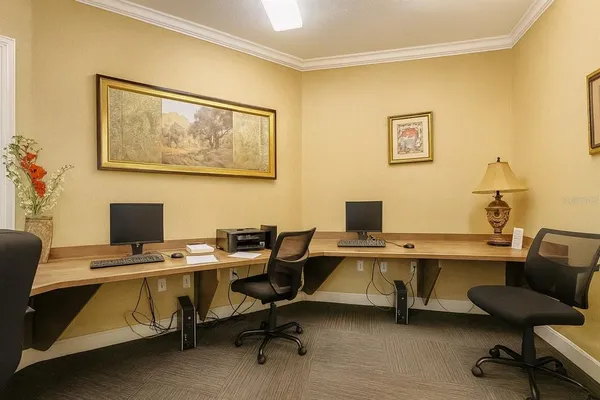 a view of a workspace with furniture and a workspace