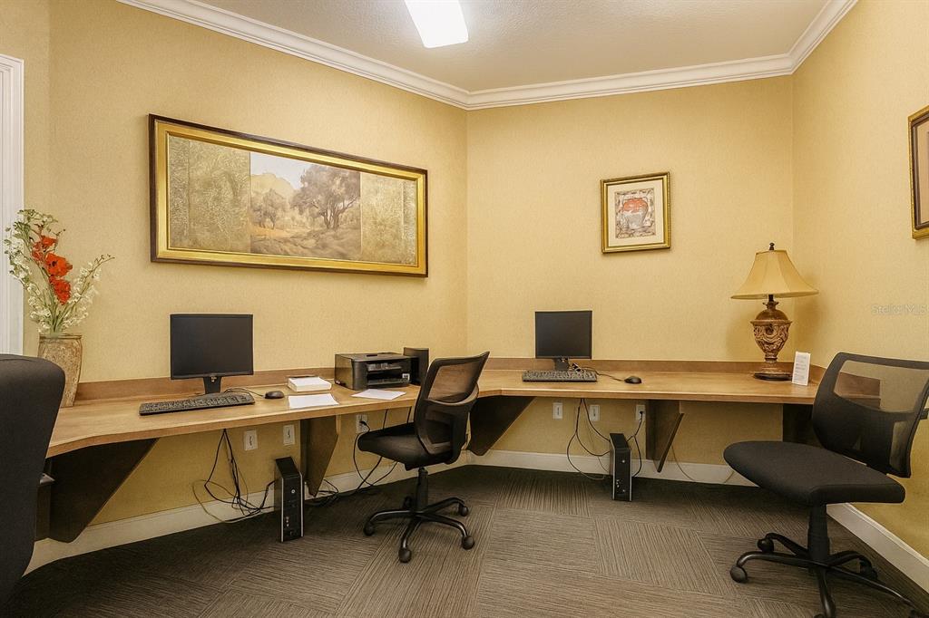4877 Northwest 42nd Road, Unit 106 Gainesville, FL 32606 - Photo 23 of 27 a view of a workspace with furniture and a workspace