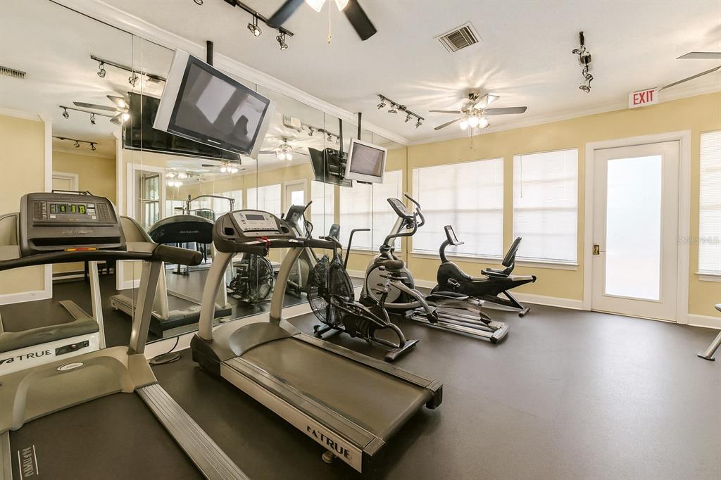 4877 Northwest 42nd Road, Unit 106 Gainesville, FL 32606 - Photo 24 of 27 a view of a room with gym equipment