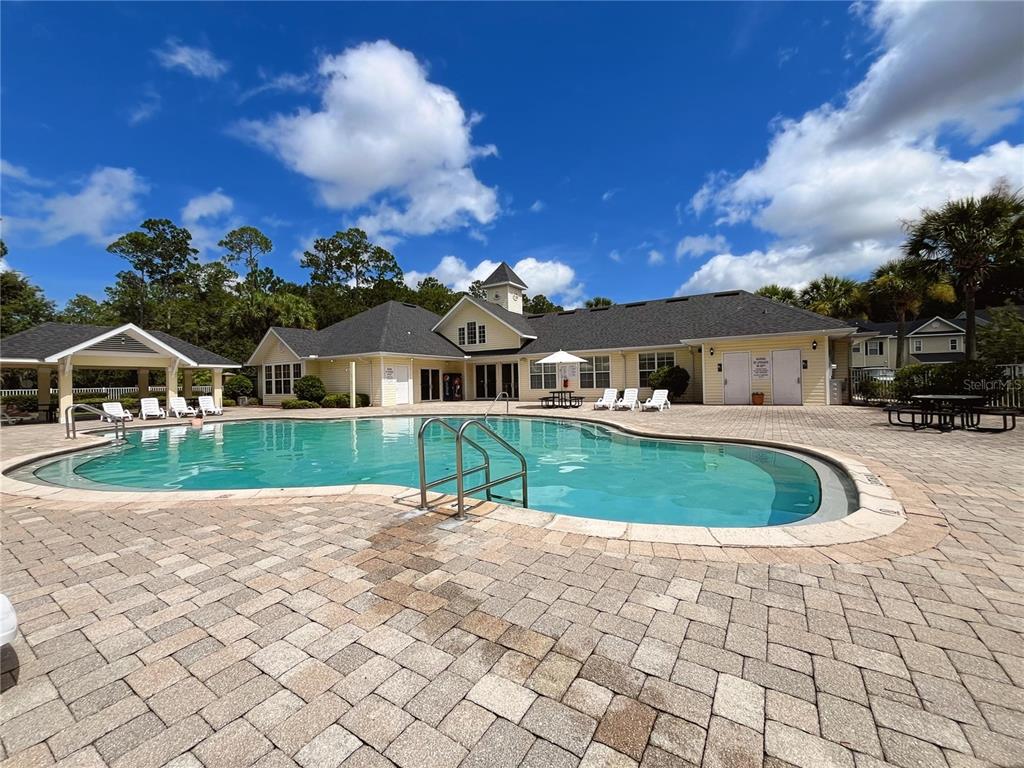 4877 Northwest 42nd Road, Unit 106 Gainesville, FL 32606 - Photo 27 of 27 a aerial view of a house with a yard and potted plants