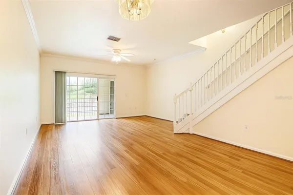 a view of an entryway with wooden floor