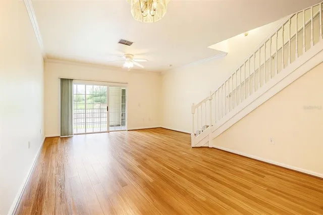 a view of an entryway with wooden floor