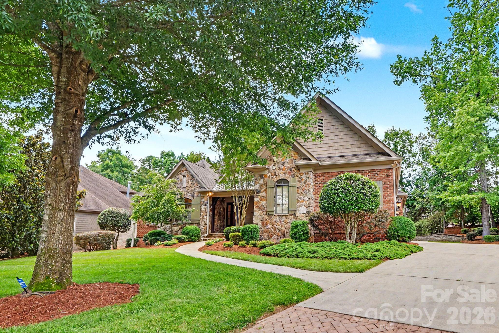 508 Hideaway Ridge Court Matthews, NC 28105 - Photo 2 of 47 a front view of a house with a yard and potted plants