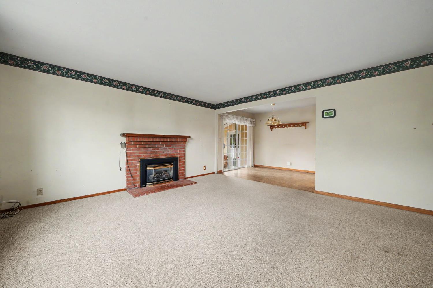 626 Sutter Lane Ione, CA 95640 - Photo 8 of 21 a view of an empty room with a fireplace