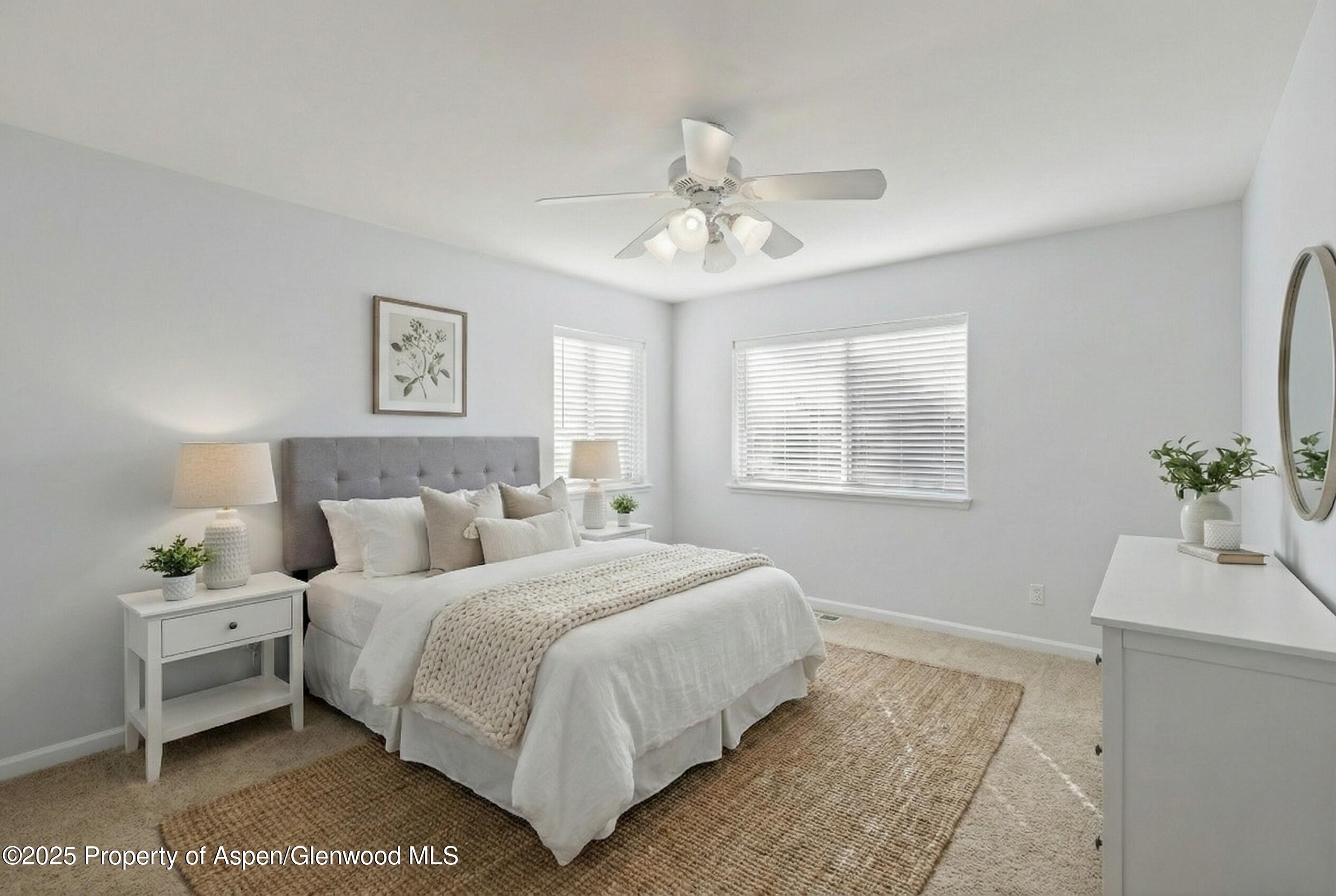 830 Donegan Road, Unit D Glenwood Springs, CO 81601 - Photo 13 of 21 a bedroom with a bed and a window