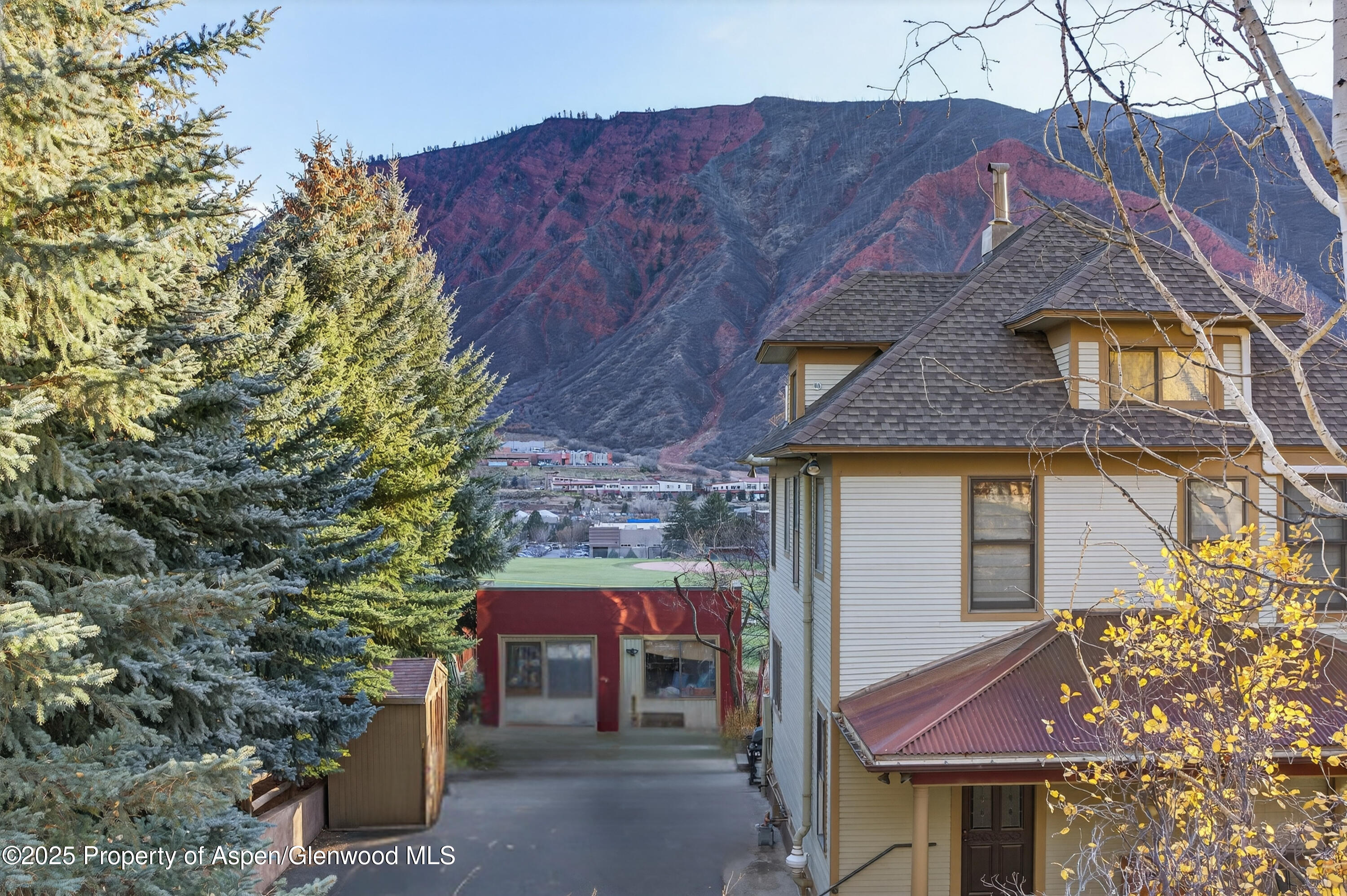 830 Donegan Road, Unit D Glenwood Springs, CO 81601 - Photo 17 of 21 a front view of a house with a yard