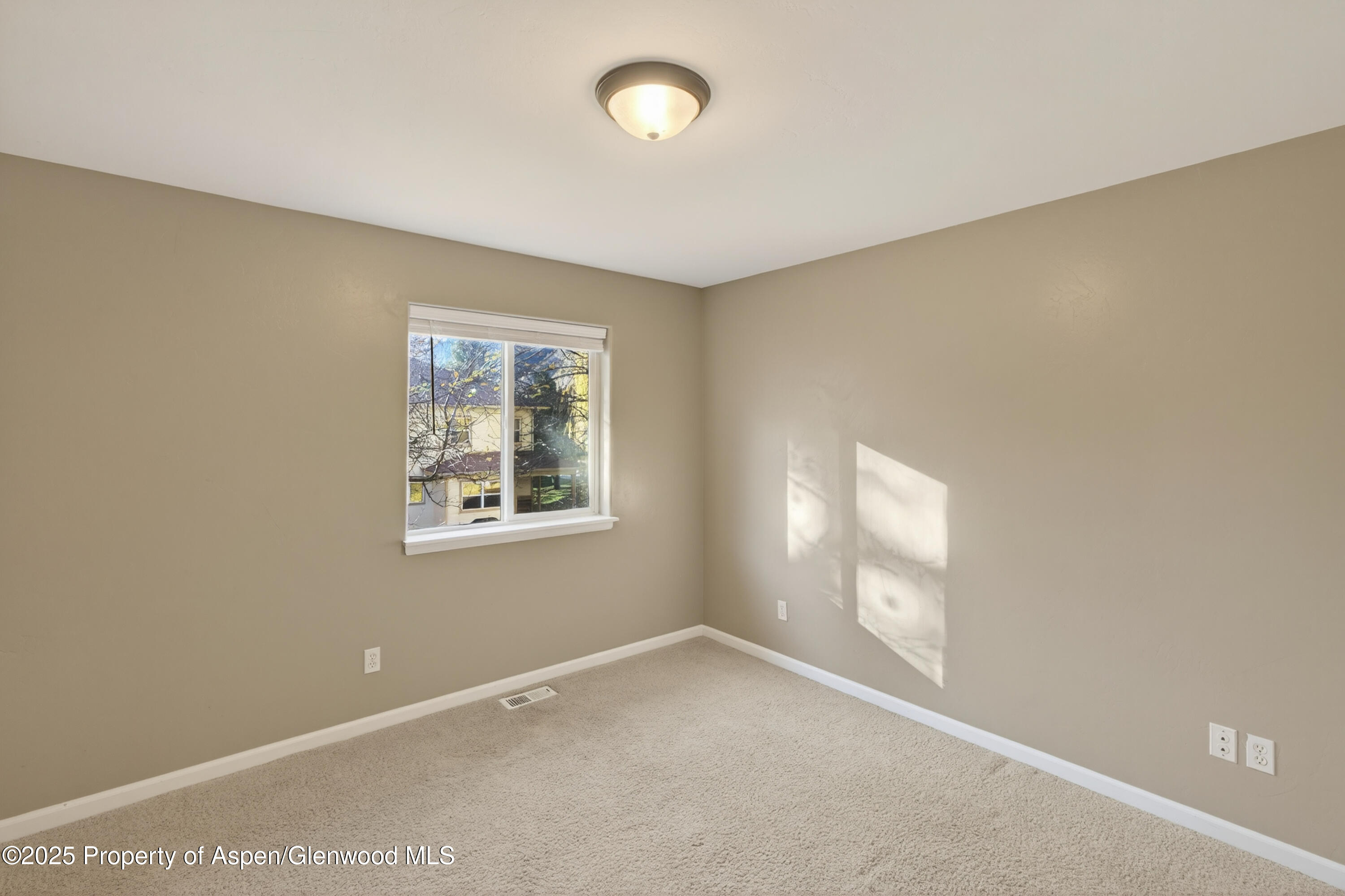 830 Donegan Road, Unit D Glenwood Springs, CO 81601 - Photo 20 of 21 a view of an empty room with a window