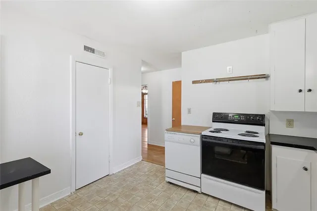 a kitchen with a stove and a microwave