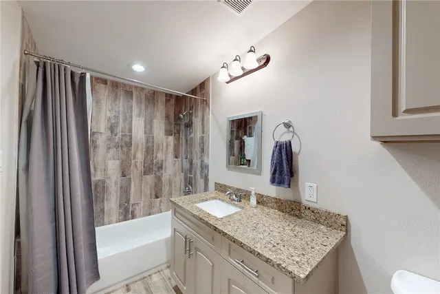 a view of a chair and table in the balcony