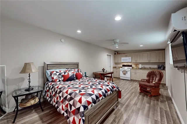 a view of a house with backyard patio and swimming pool