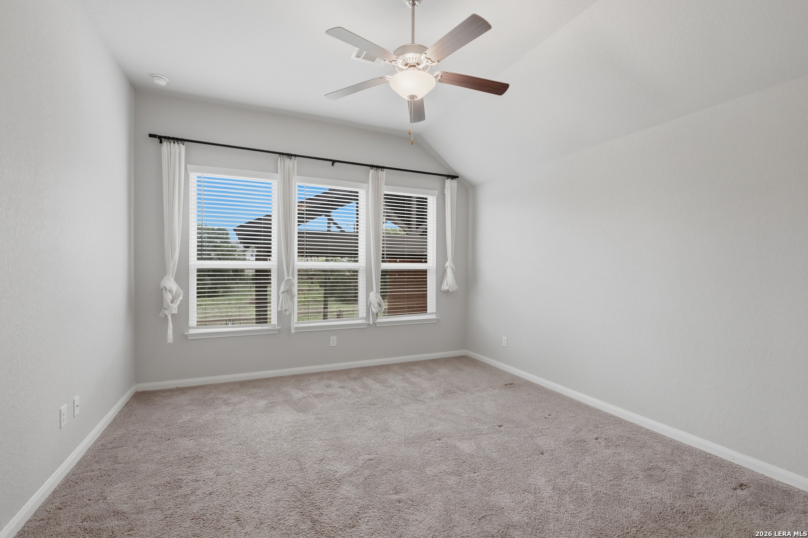 32125 Cardamom Way Bulverde, TX 78163 - Photo 15 of 32 an empty room with a window and a fan