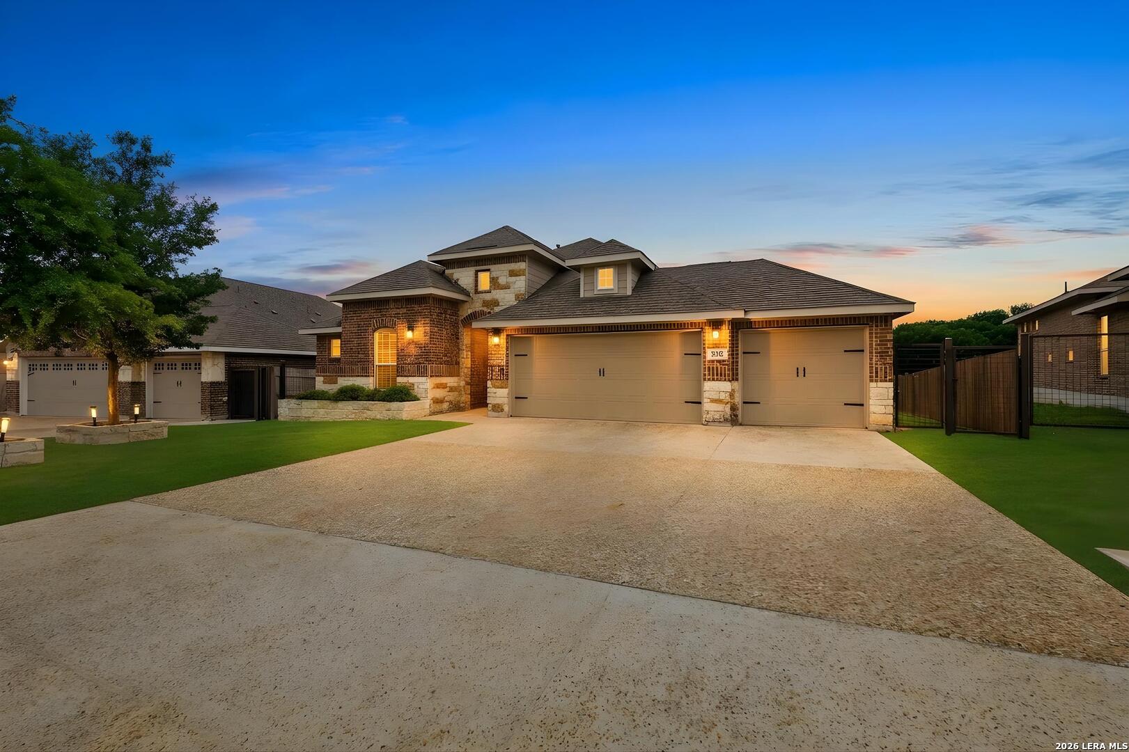 32125 Cardamom Way Bulverde, TX 78163 - Photo 2 of 32 a front view of a house with a yard and garage