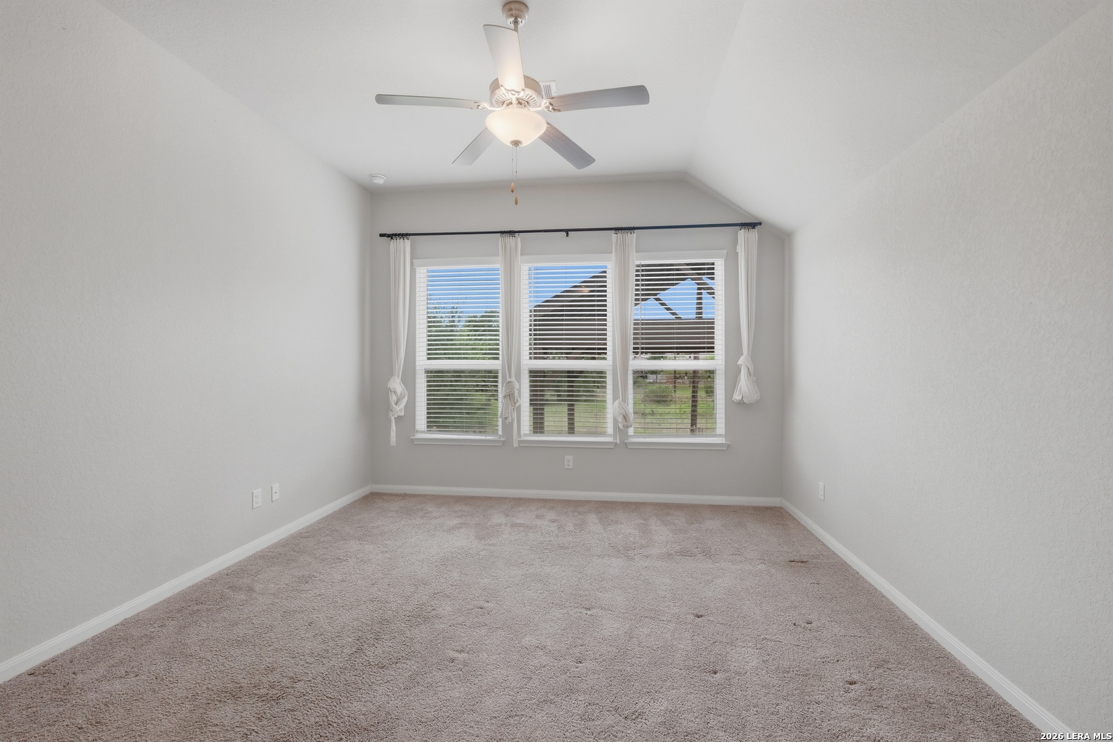 32125 Cardamom Way Bulverde, TX 78163 - Photo 21 of 32 an empty room with a window and a fan