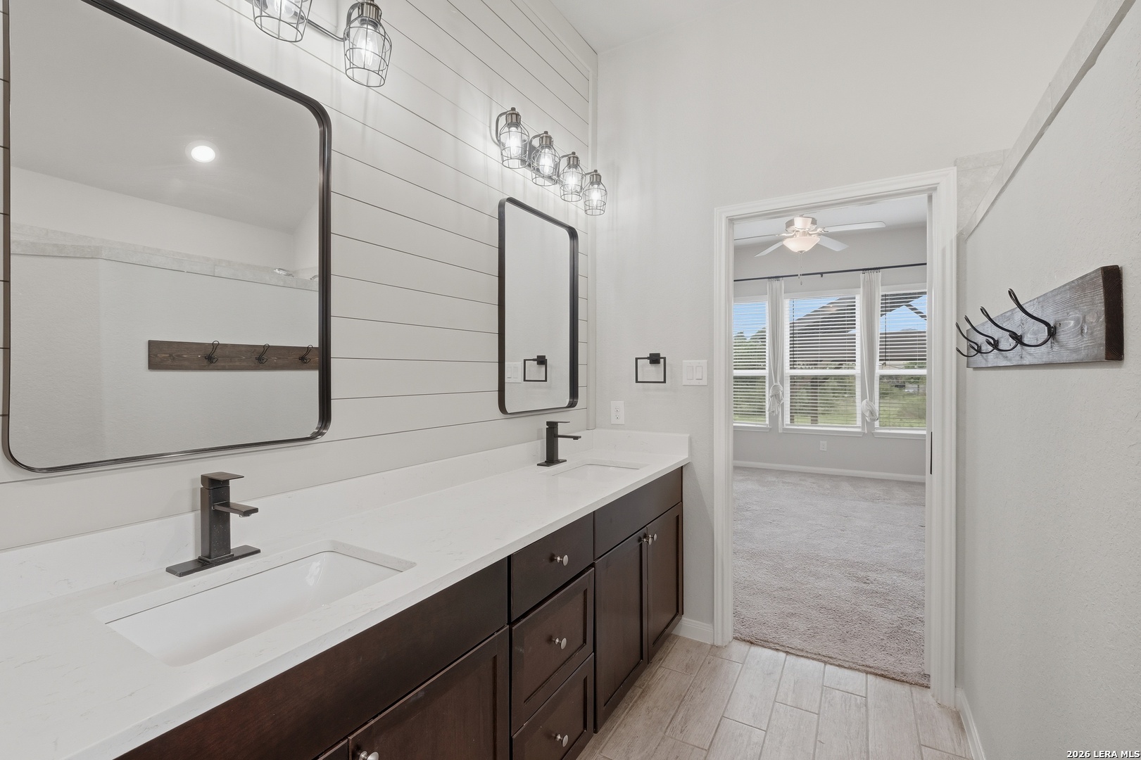 32125 Cardamom Way Bulverde, TX 78163 - Photo 22 of 32 a bathroom with a sink and a mirror