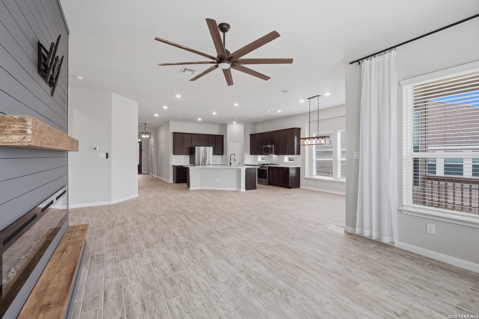32125 Cardamom Way Bulverde, TX 78163 - Photo 7 of 32 a view of a kitchen with a sink and a stove top oven