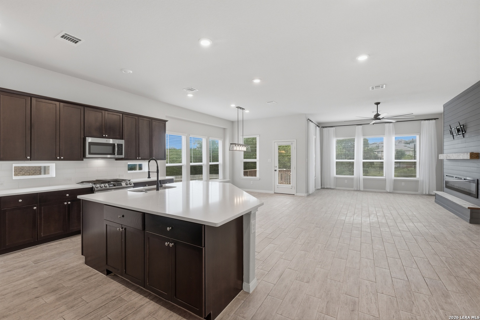 32125 Cardamom Way Bulverde, TX 78163 - Photo 9 of 32 a kitchen with stainless steel appliances granite countertop a sink stove and cabinets