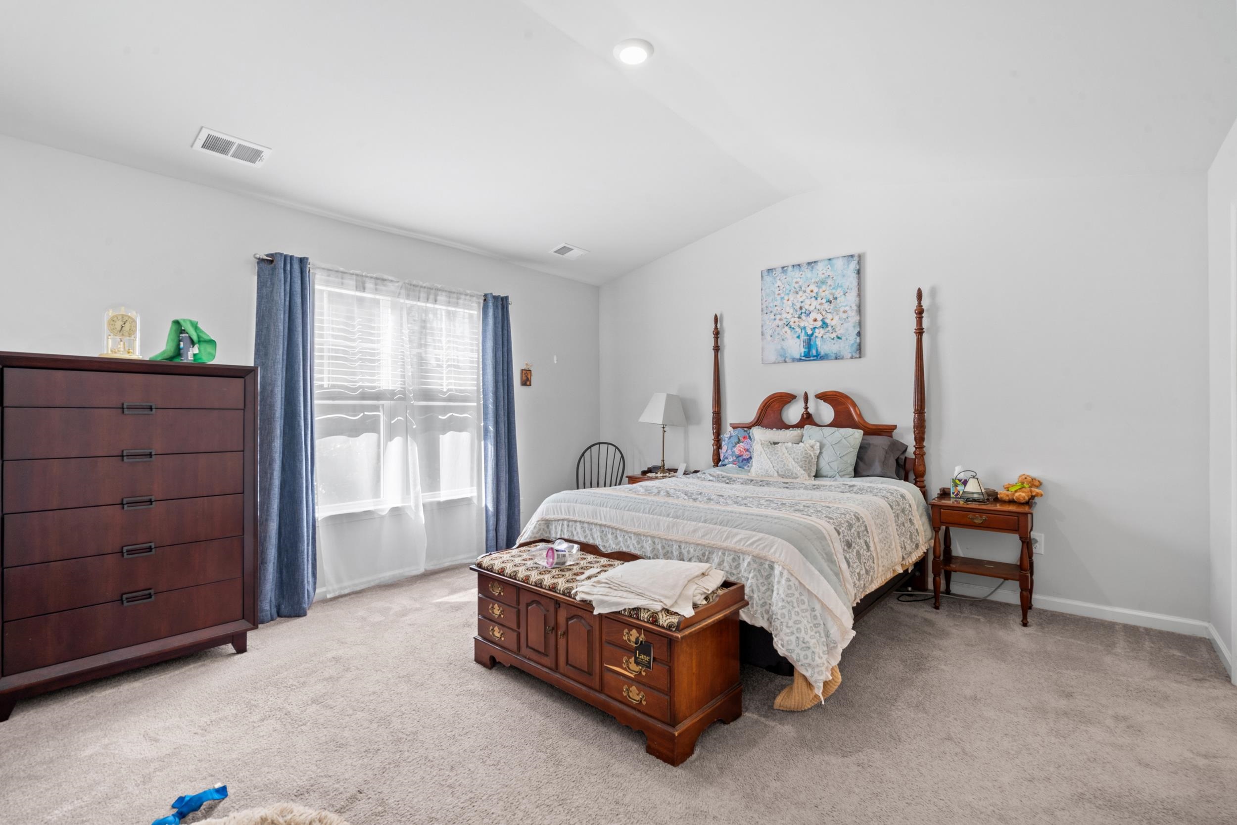 1404 Jardine Loop Little River, SC 29566 - Photo 19 of 31 Bedroom with light carpet, vaulted ceiling, and ensuite bath