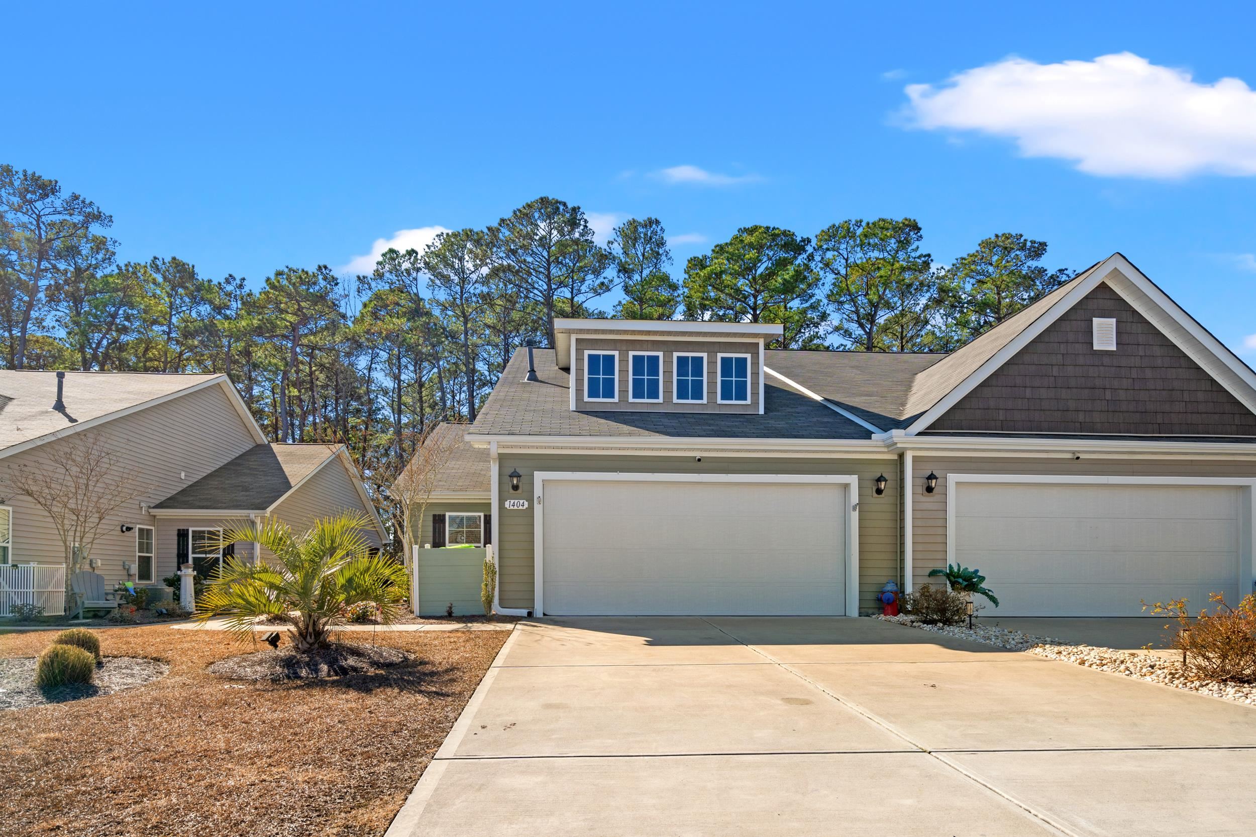 1404 Jardine Loop Little River, SC 29566 - Photo 3 of 31 View of front facade with driveway and a garage