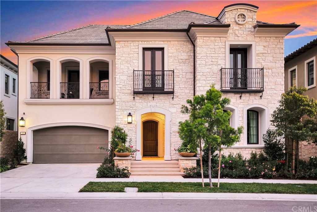 113 Spacial Irvine, CA 92618 - Photo 1 of 1 a front view of a house with a yard and garage