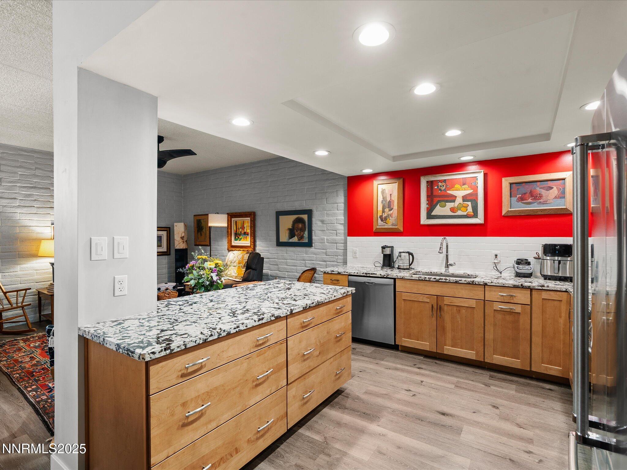 1200 Riverside Drive, Unit 1276 Reno, NV 89503 - Photo 22 of 47 a kitchen with granite countertop sink stove and refrigerator