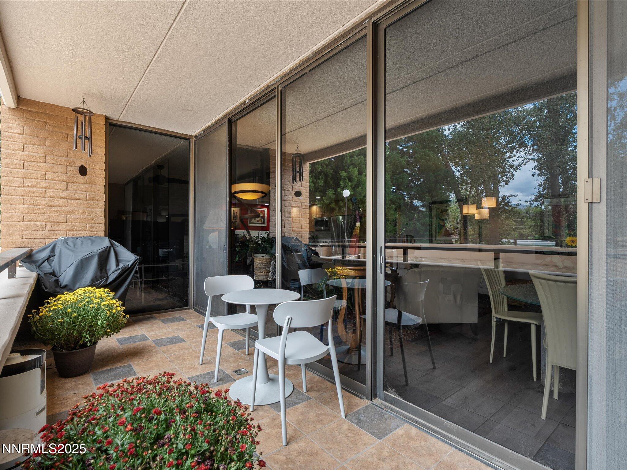 1200 Riverside Drive, Unit 1276 Reno, NV 89503 - Photo 23 of 47 a view of a porch with chairs and potted plants