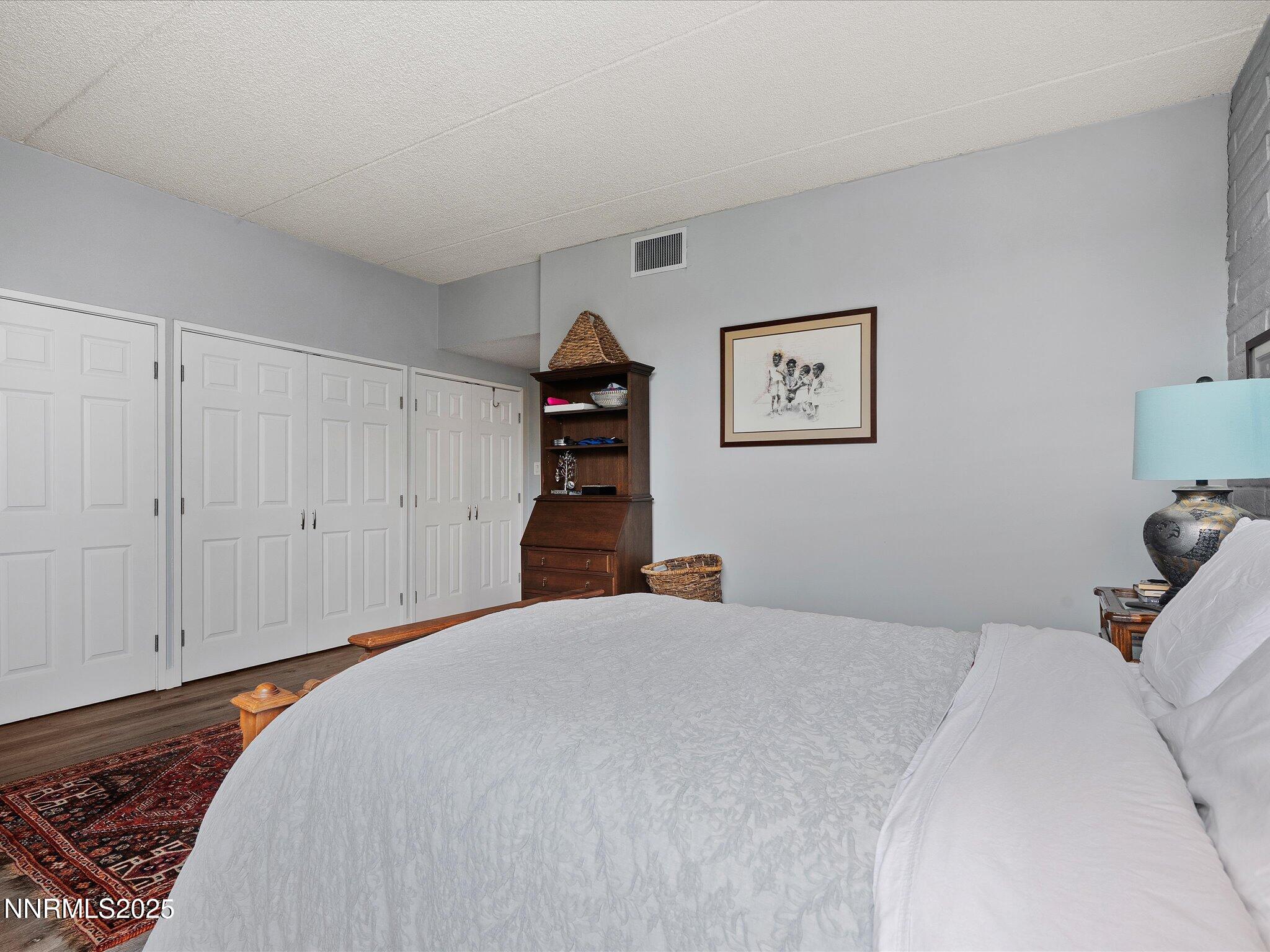 1200 Riverside Drive, Unit 1276 Reno, NV 89503 - Photo 27 of 47 a bedroom with a bed and a book shelf