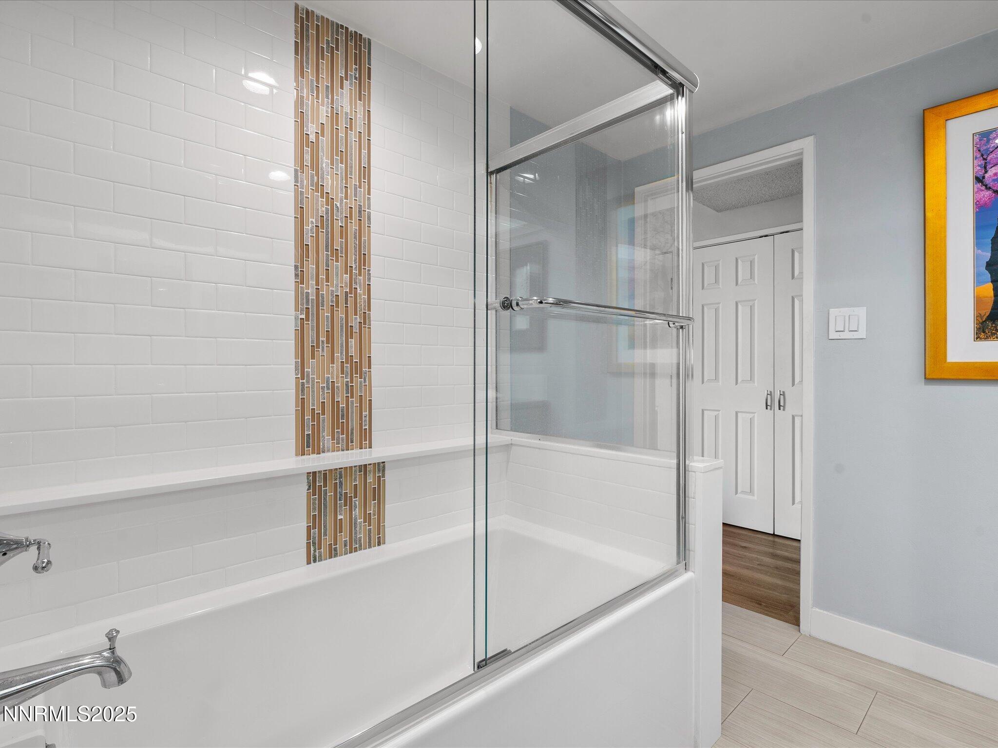 1200 Riverside Drive, Unit 1276 Reno, NV 89503 - Photo 30 of 47 a bathroom with a bathtub and a shower
