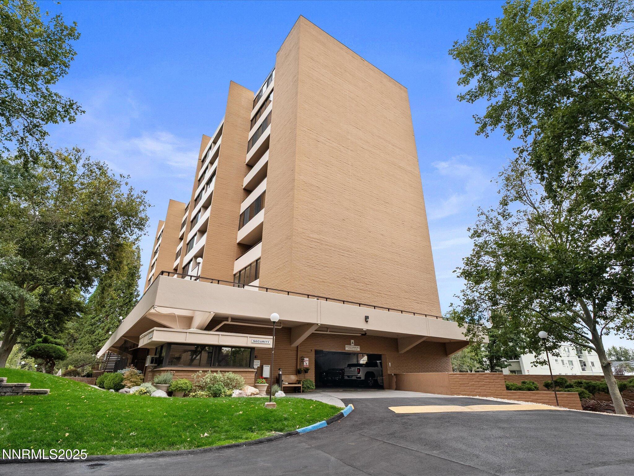 1200 Riverside Drive, Unit 1276 Reno, NV 89503 - Photo 36 of 47 a front view of a building with a garden and trees
